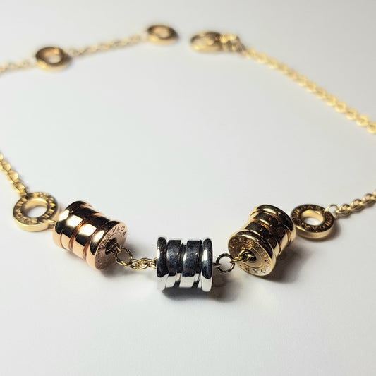BVLGARI - Bracciale in oro giallo 18k B.zero1 con 3 pendenti